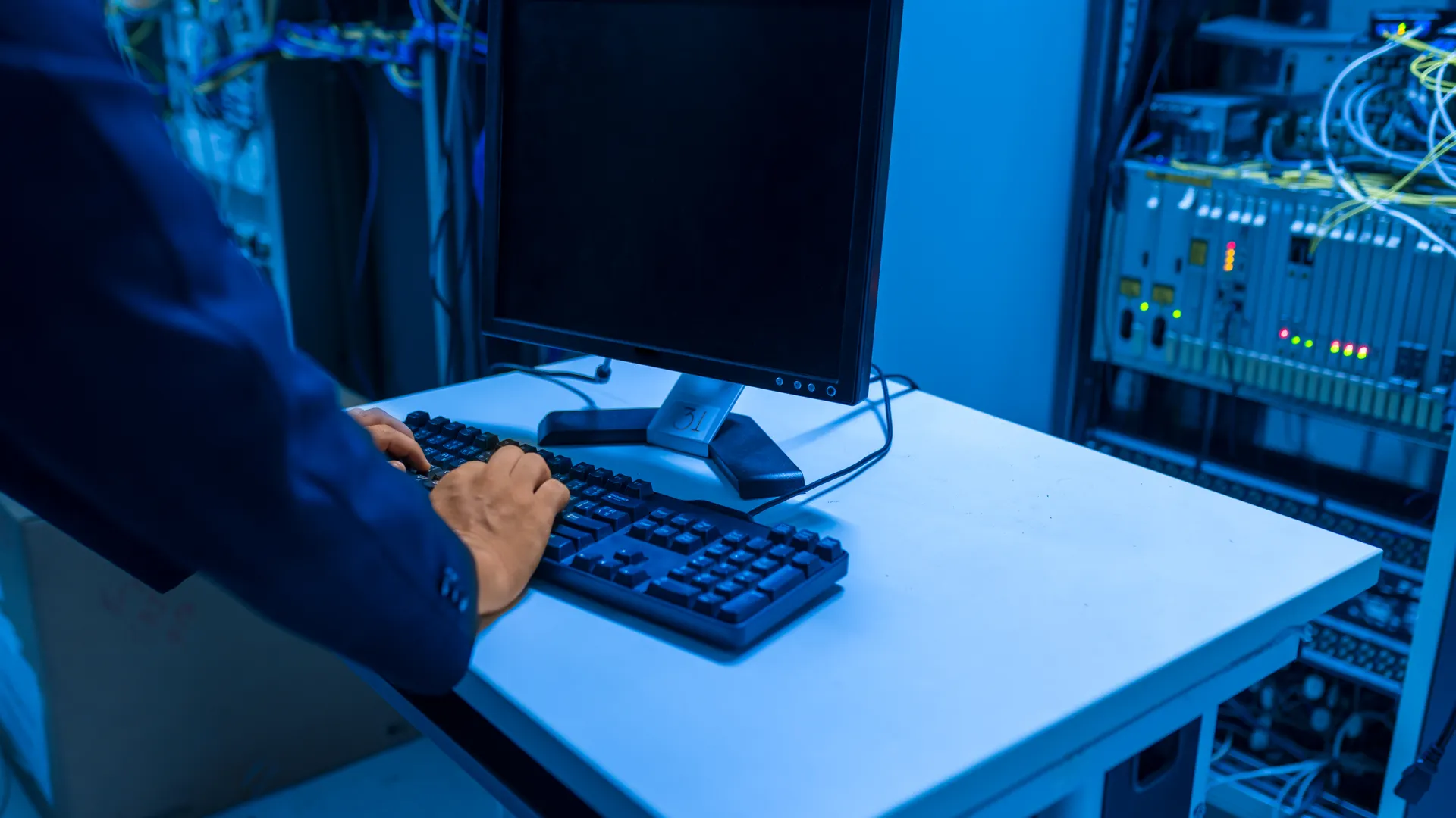 An IT professional operates a computer