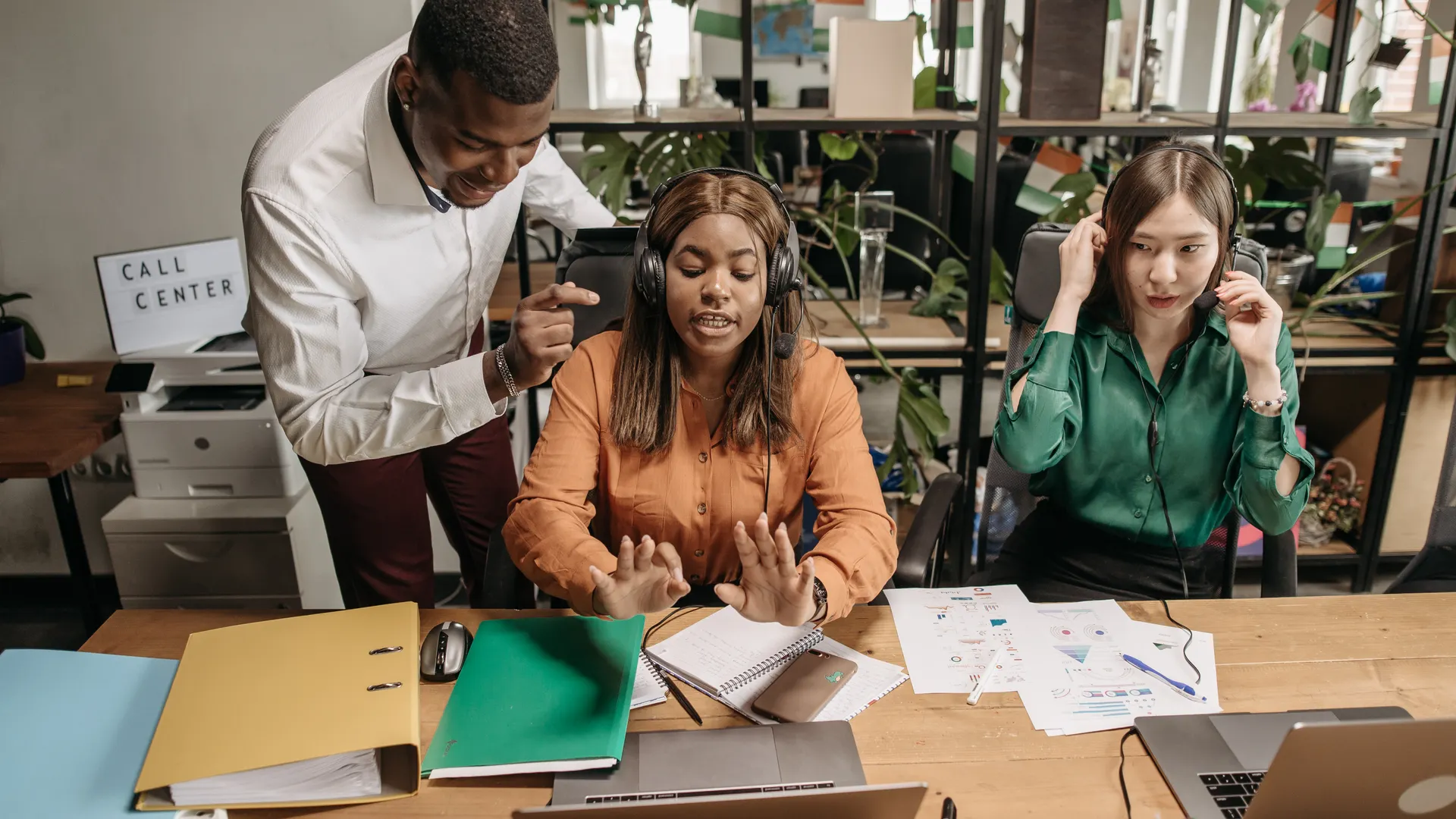 A diverse group of call center employees collaborating
