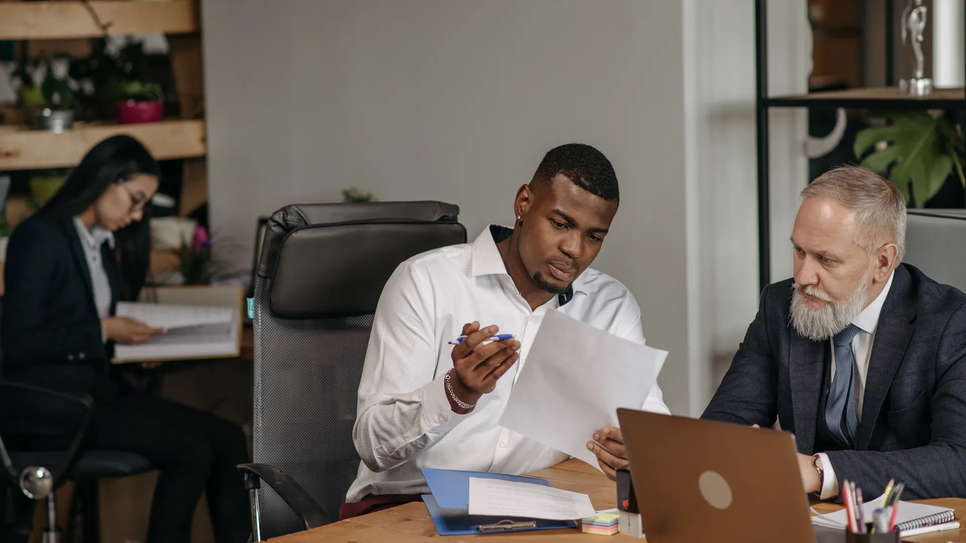 Business professionals discussing documents