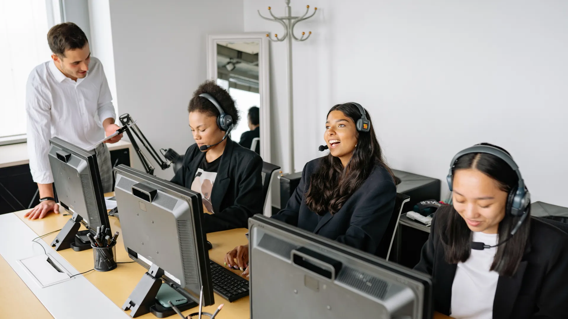 A diverse team of customer service representatives working