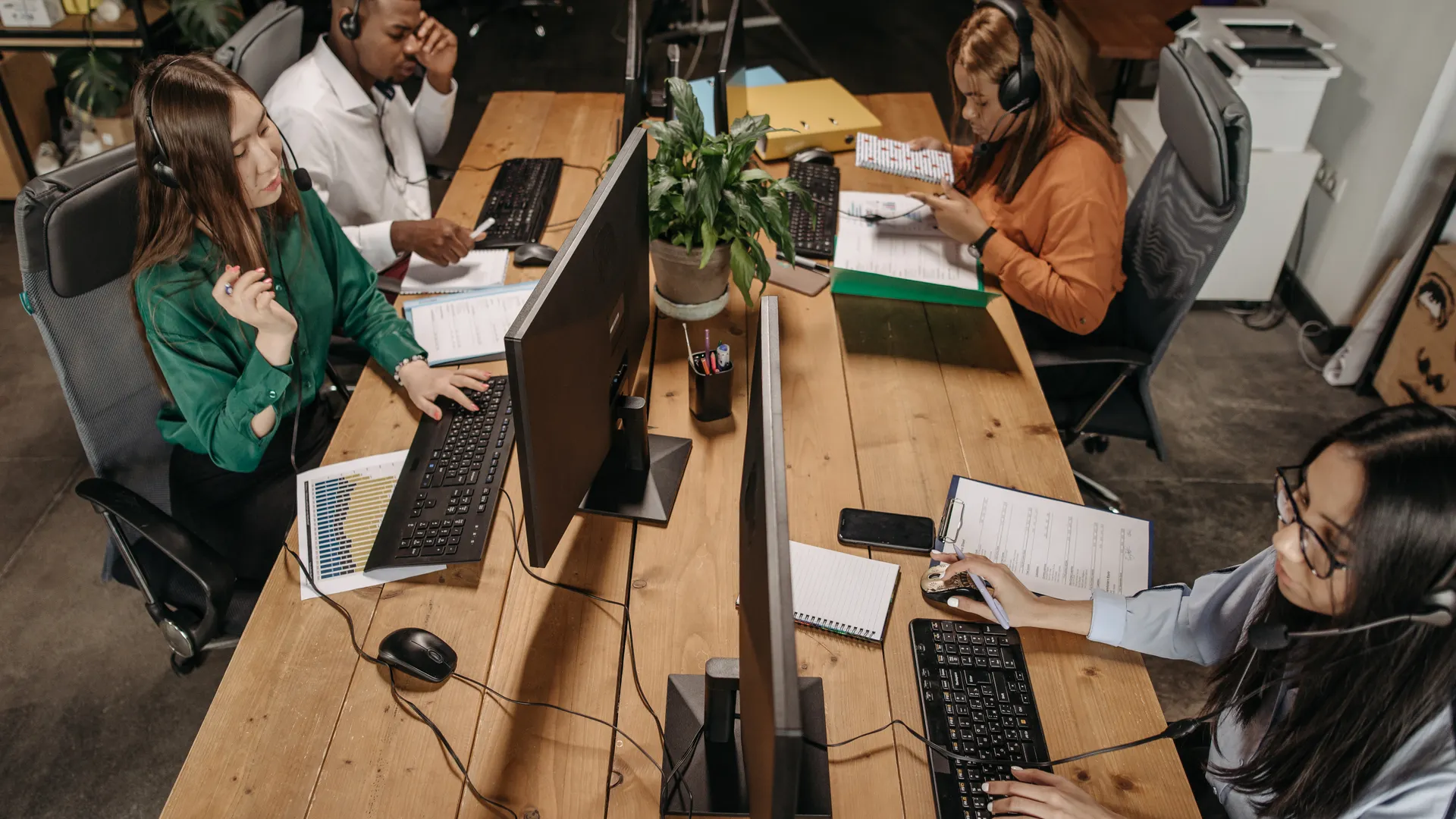 Diverse team of customer service representatives working collaboratively
