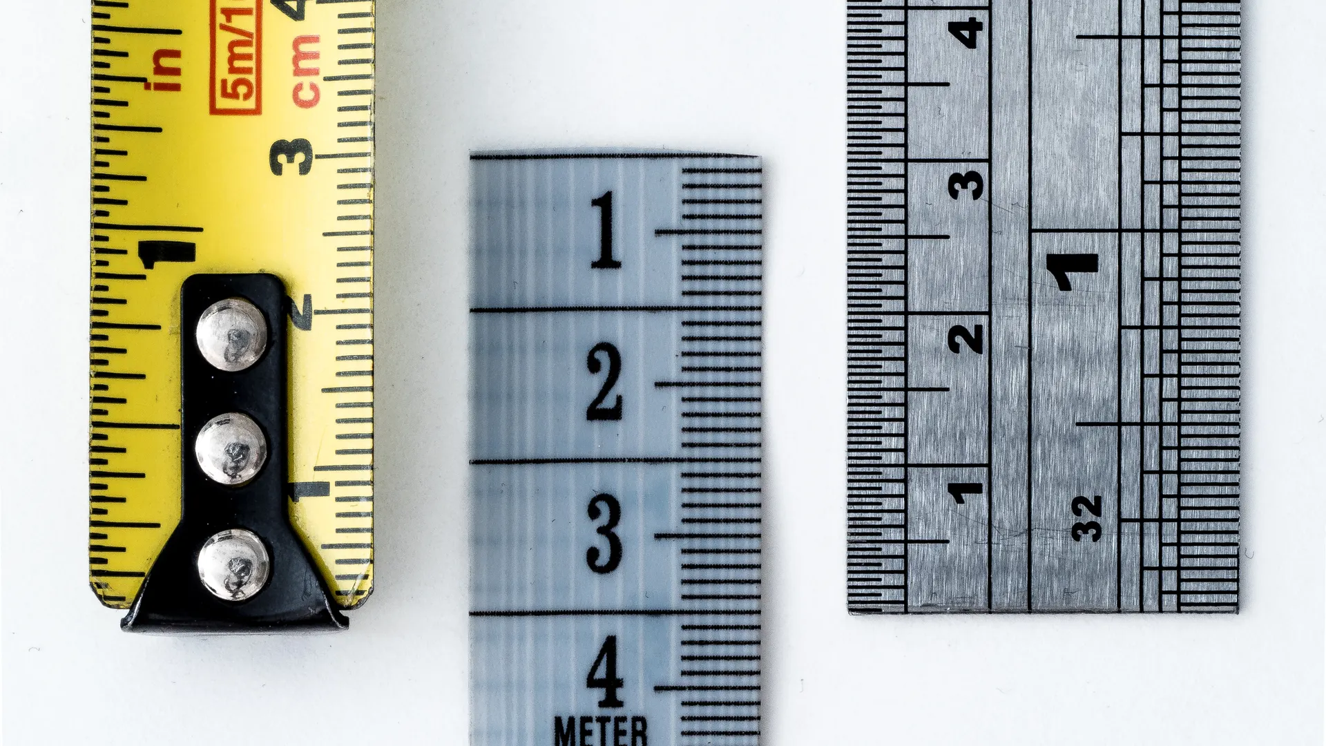 High-resolution image of a tape measure and rulers