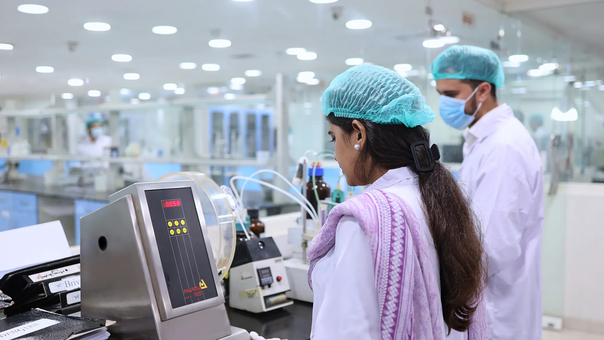 Scientists conducting tests in a pharmaceutical lab in Islamabad, Pakistan
