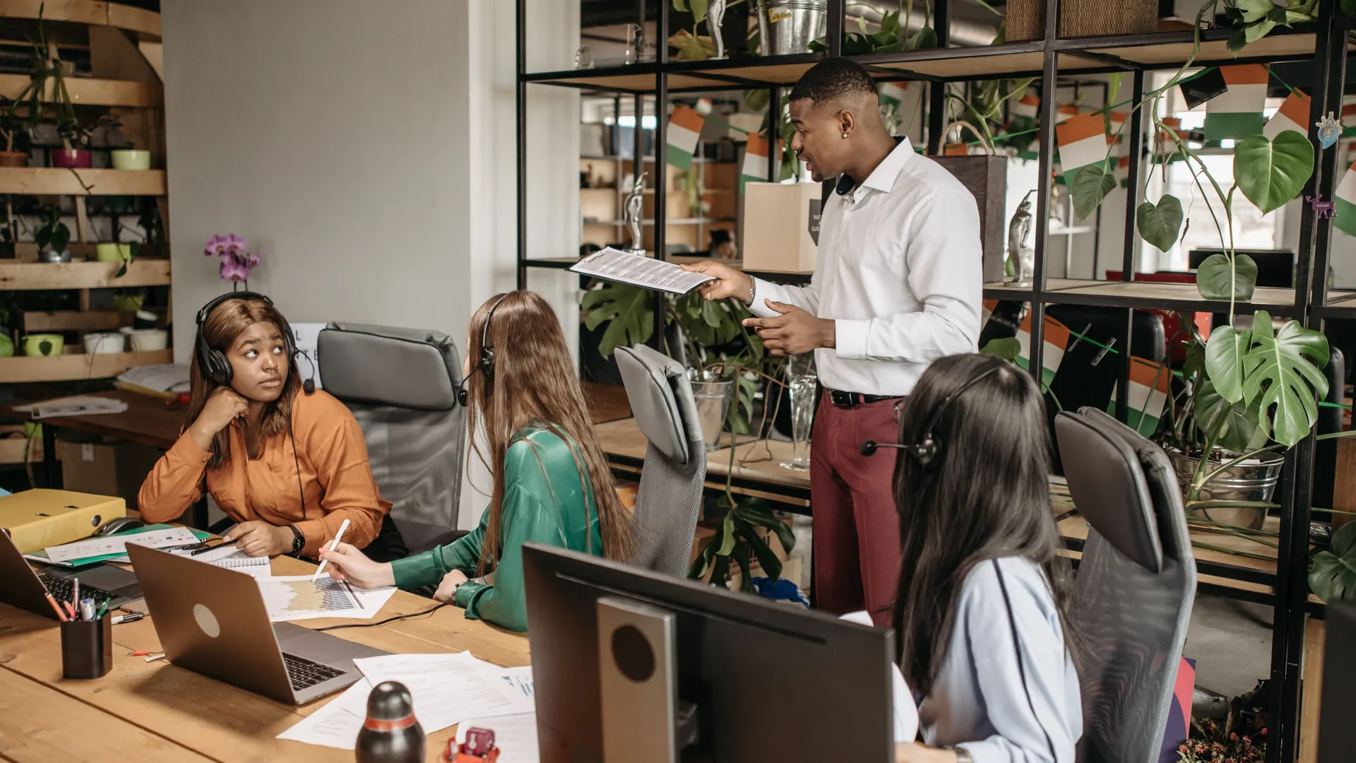 Diverse group of call center agents collaborating in a modern office space