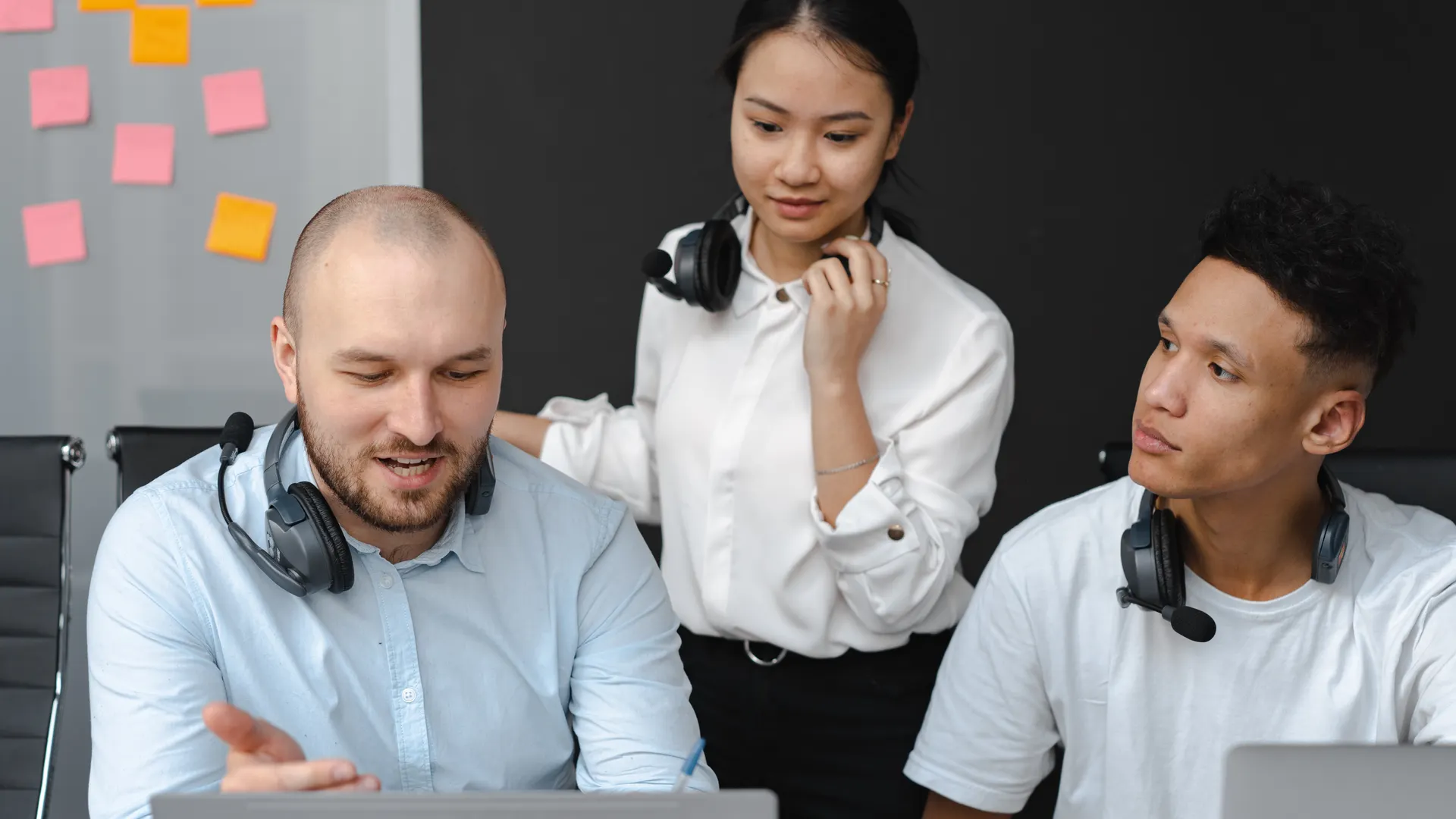 A diverse group of customer service representatives collaborating in a modern office setting