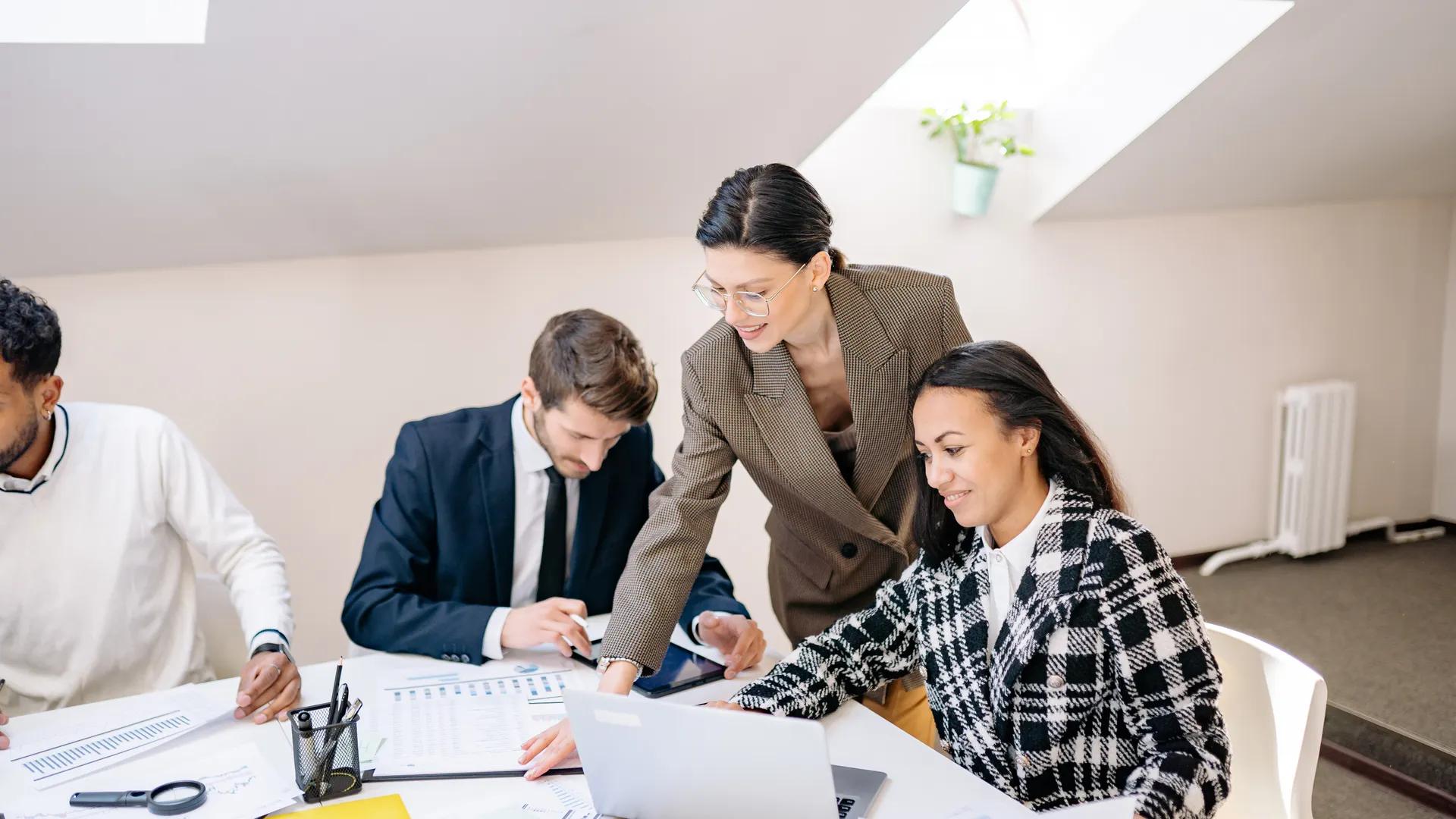 Colleagues collaborating in a modern office during a daytime meeting