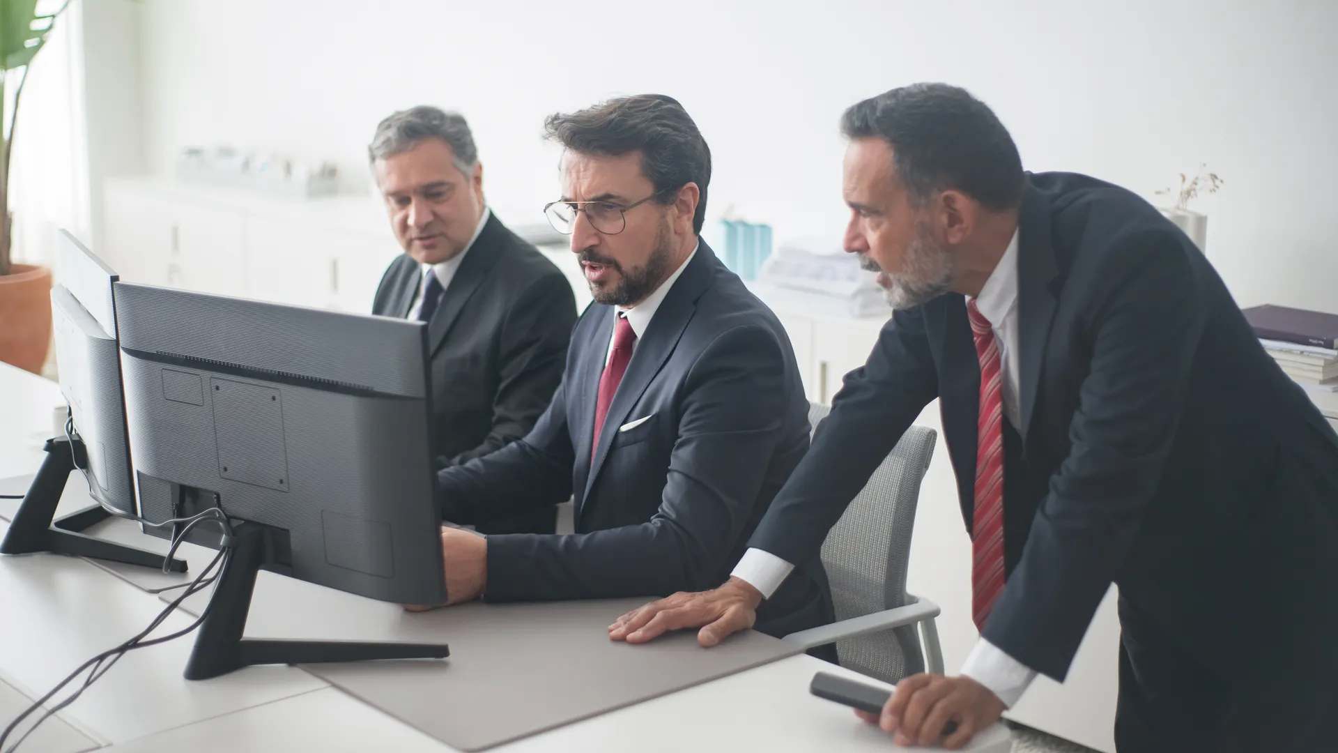 Professionals collaborating on a project in a modern office setting